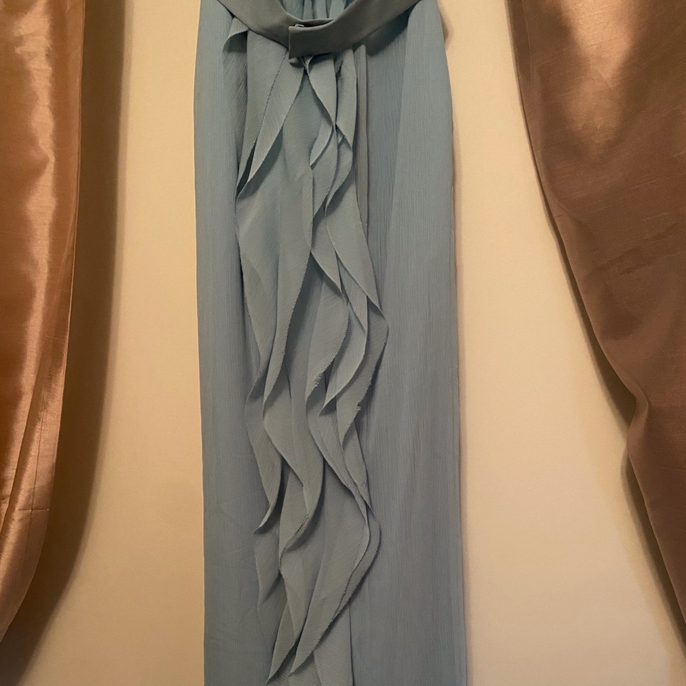 Brides maid dresses,light blue with waves combing down the side.